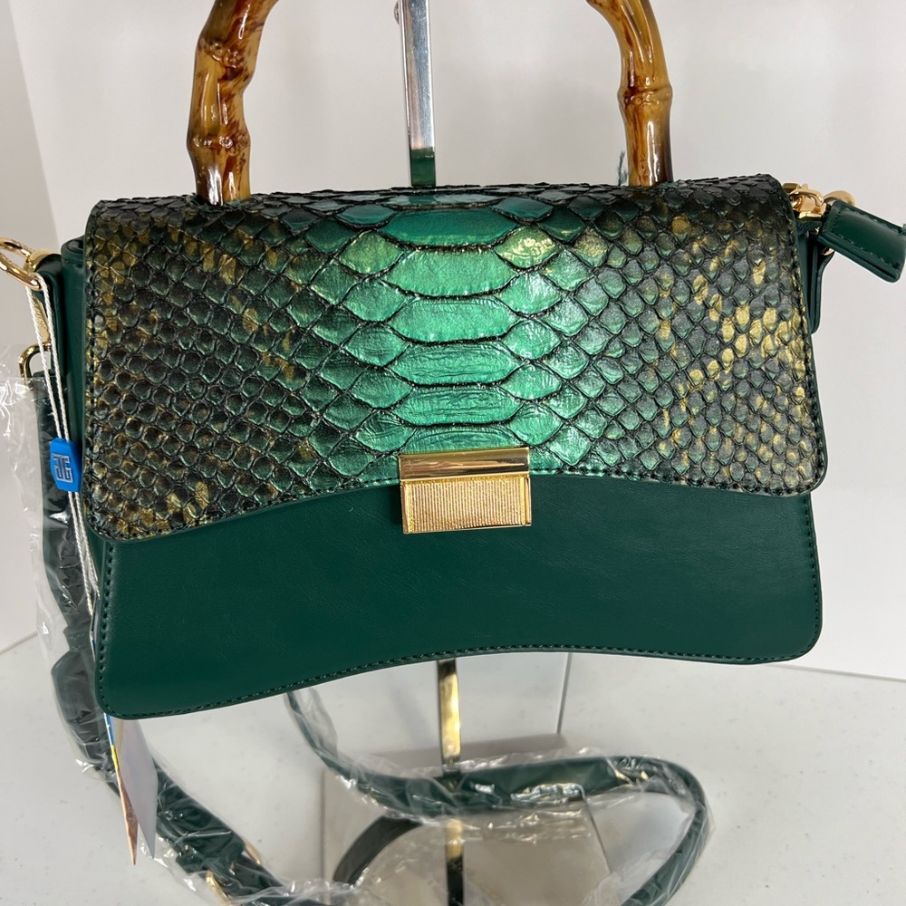 Emerald green purse with reptile design flap closure.  Bamboo handle, crossbody